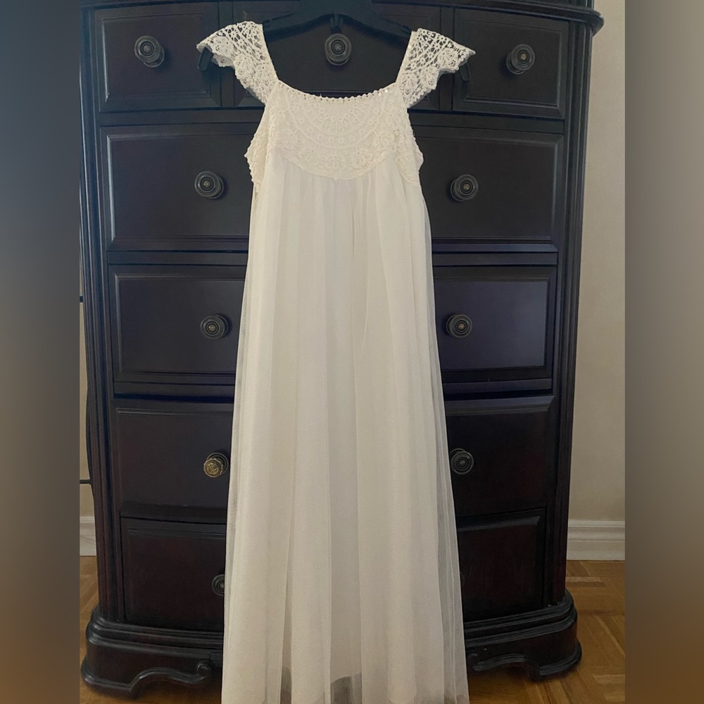 Beautiful white fancy dress. Delicate sequin and tool. Floor length.